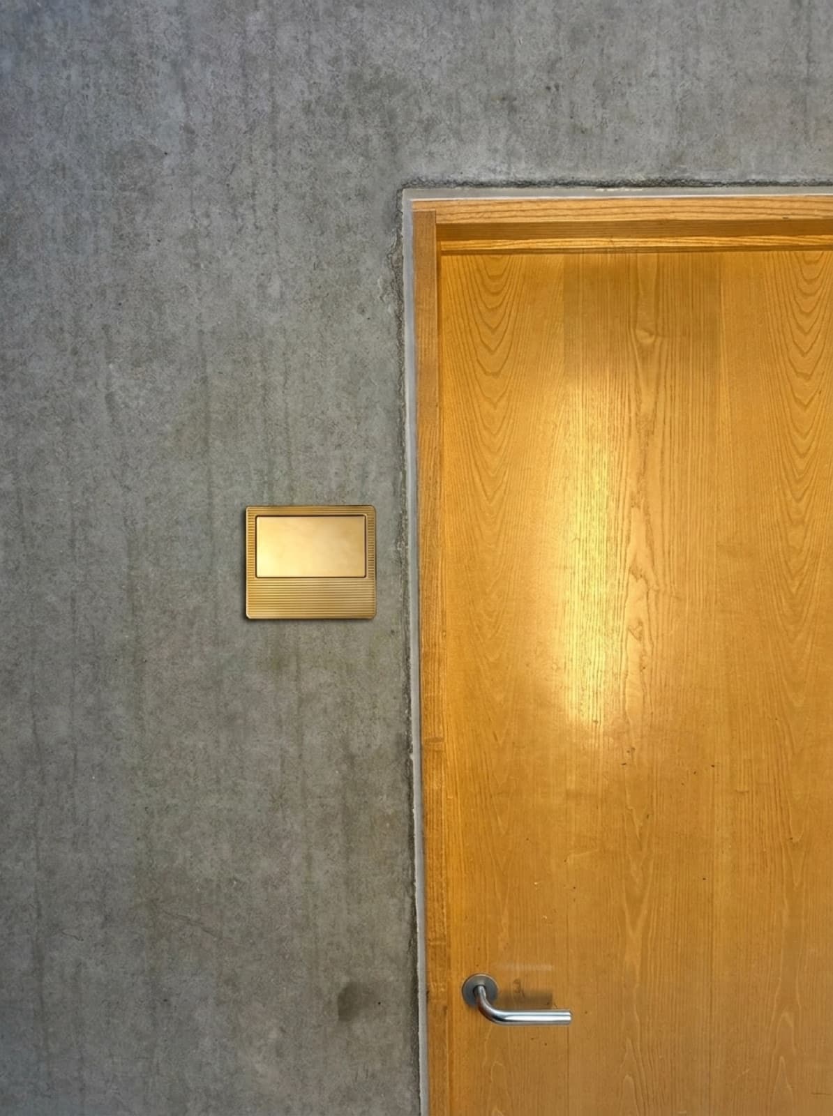 Brass sign by oak door